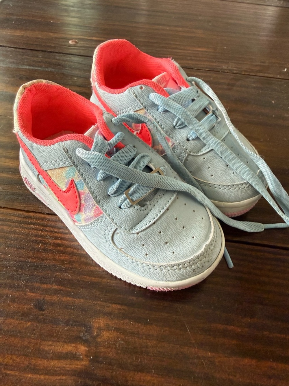 Nike light blue and pink Air Force sneakers